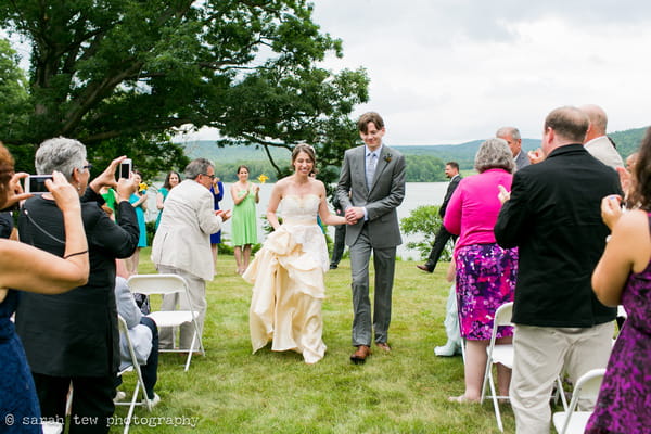 Bride and groom walking back down aisle