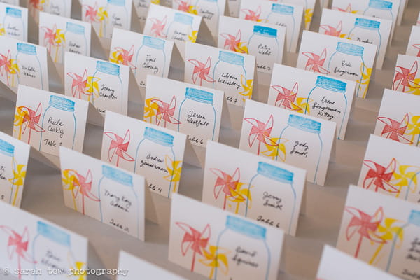 Wedding escort cards with pinwheel picture