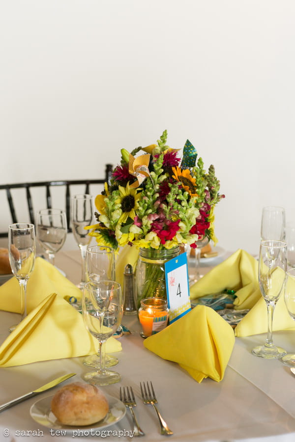 Bright and bold wedding table flowers