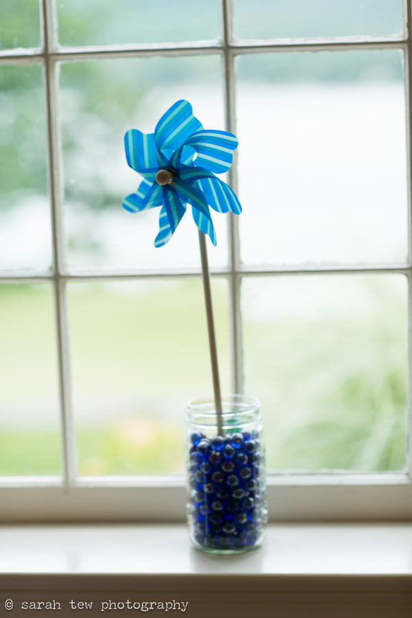 Blue pinwheel on window ledge