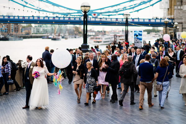Wedding party walking through London