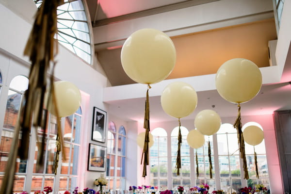 Balloons tied to wedding tables