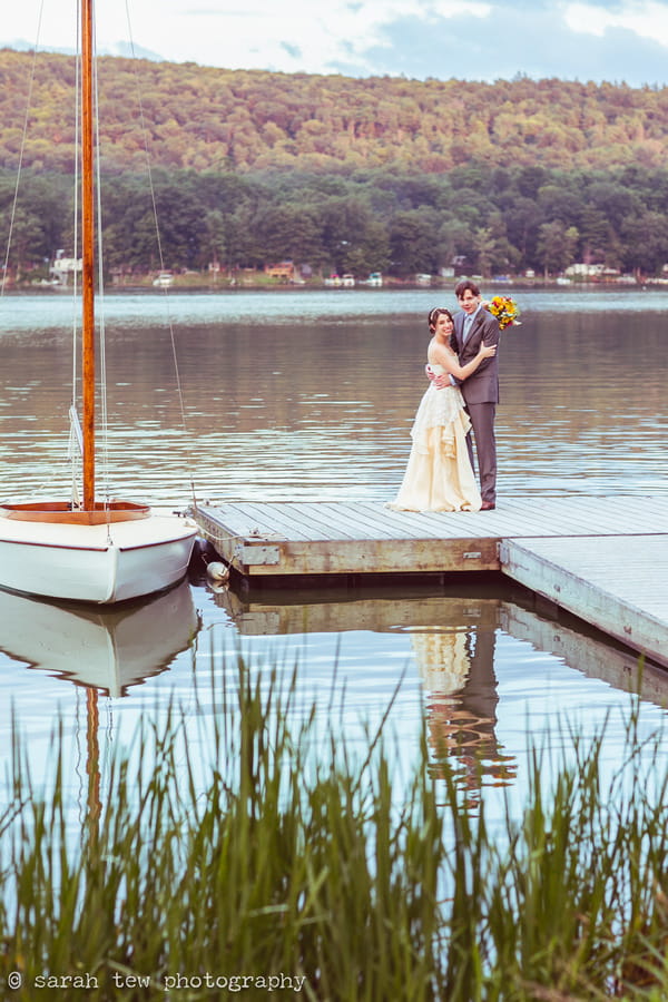 Bride and groom on jetty at Finger Lakes