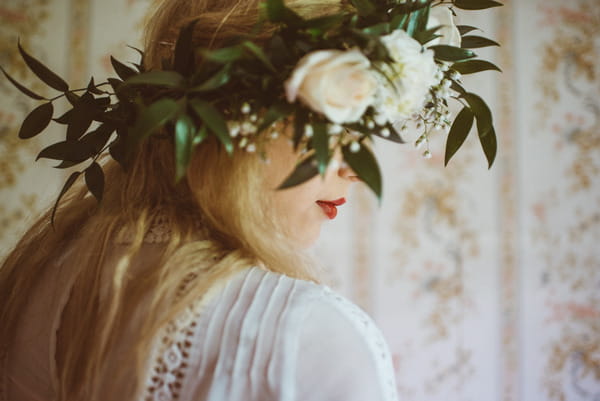 Bride wearing rose and foliage crown