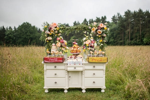Rustic dresser of wedding wedding cakes and desserts