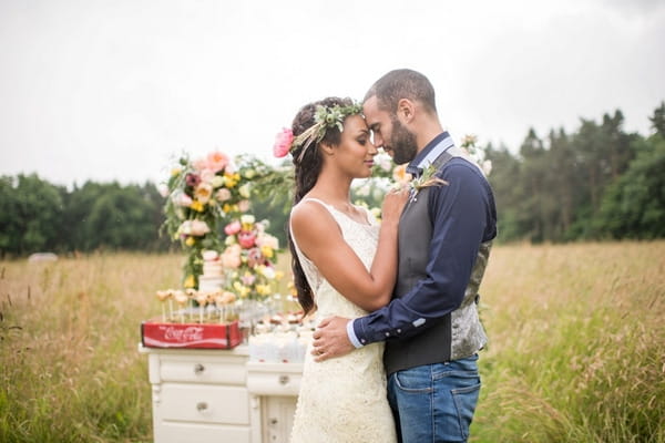 Bride and groom in meadow