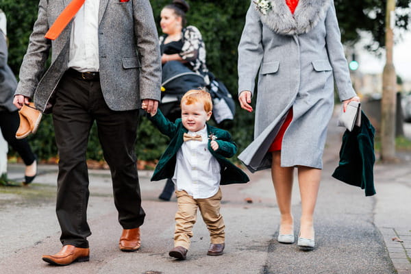 Pageboy walking to wedding ceremony