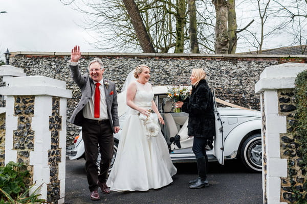 Bride arriving at church with father