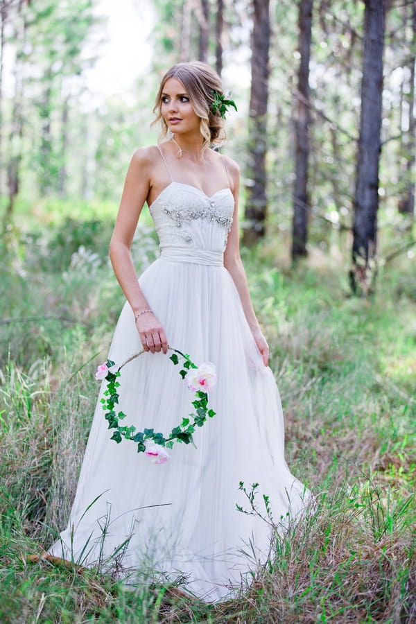 Bride holding floral hoop