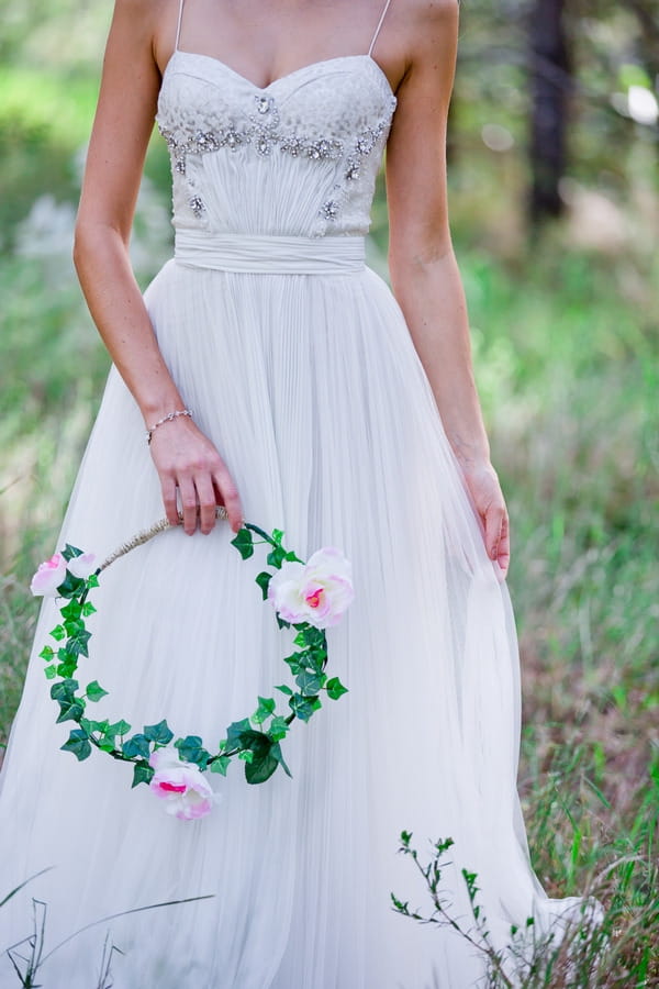 Bride holding floral hoop