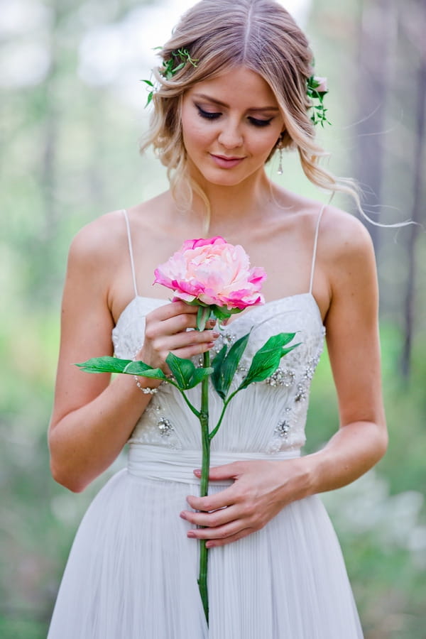 Bride holding large flower
