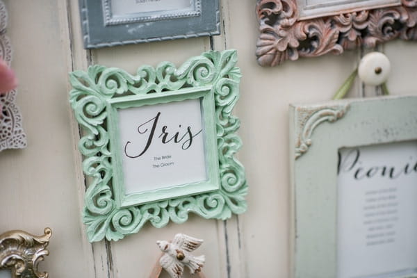 Green picture frame on wedding seating plan