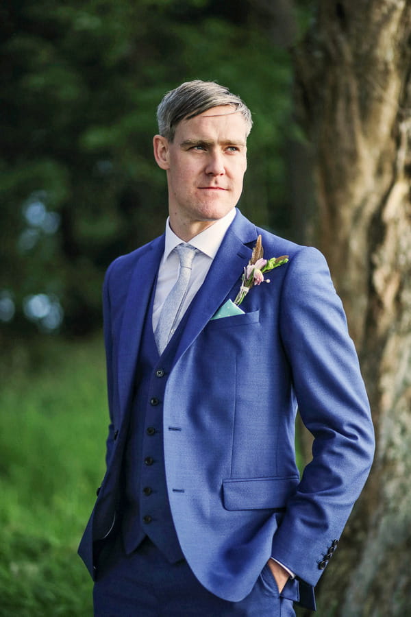 Groom in blue suit