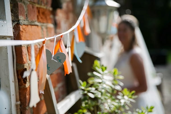 Orange and white tassel wedding decor