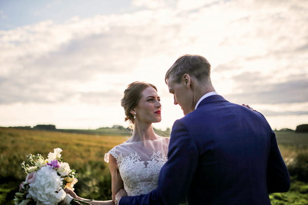 Bride and groom in countryside