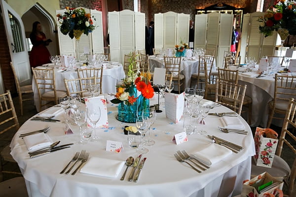 Wedding table with colourful flower centrepiece