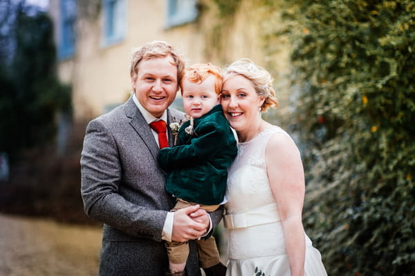 Bride and groom with son