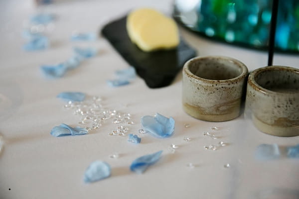 Blue petals on wedding table