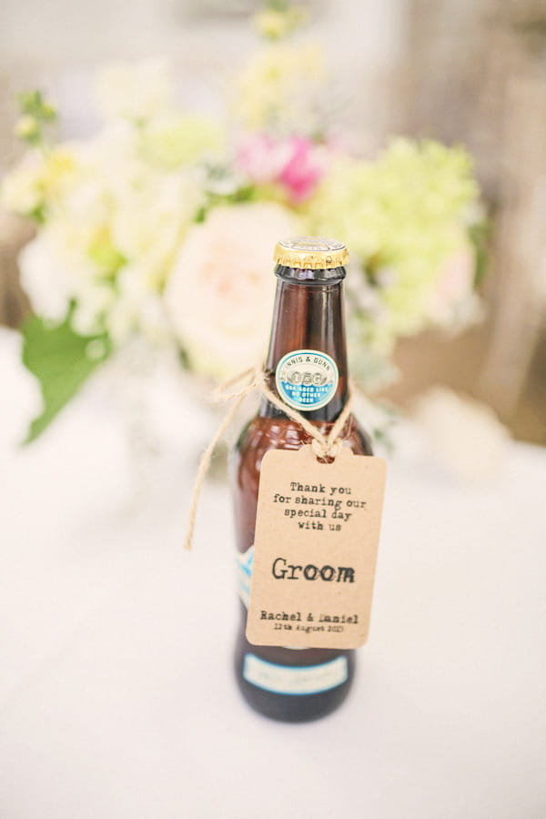 Bottle of beer with groom tag