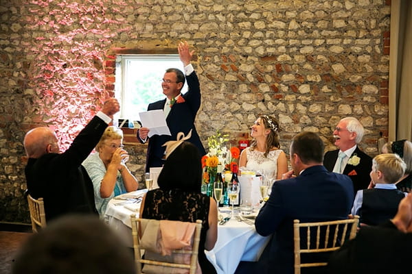 Raising toast at wedding
