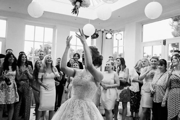 Bride tossing bouquet