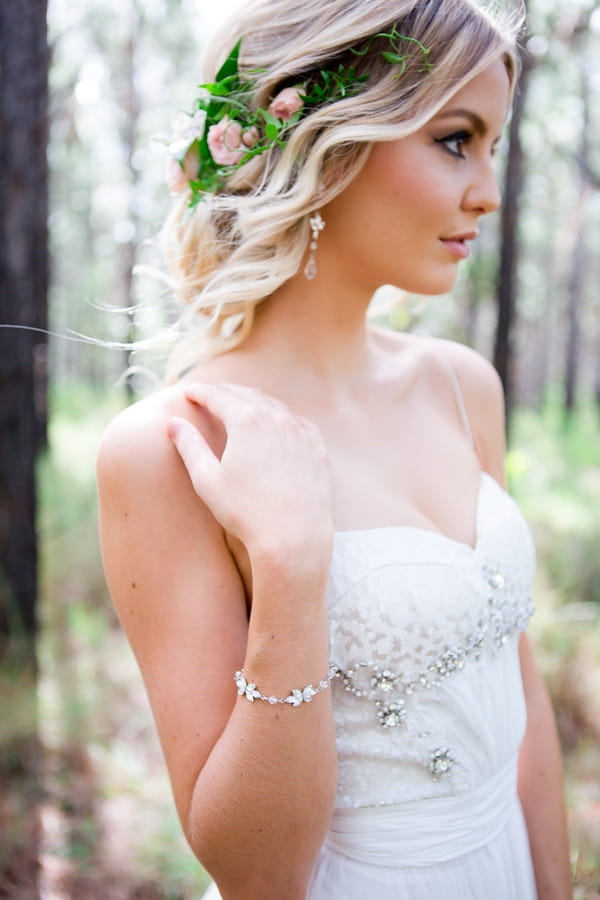 Bride with updo and flower hairpiece