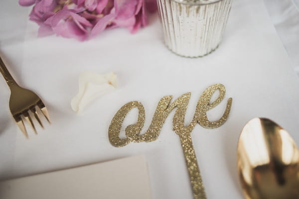 Metallic gold wedding table number