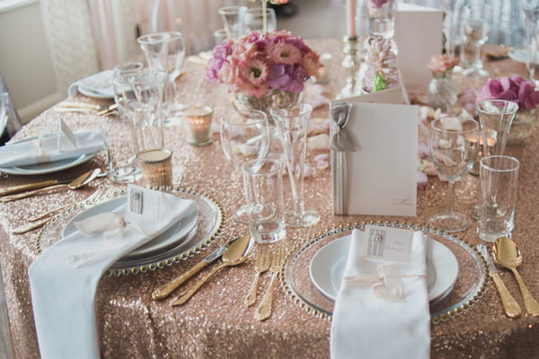 Wedding table with metallic gold sequin table cloth