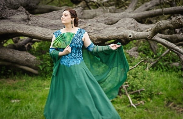 Bride posing in green wedding dress