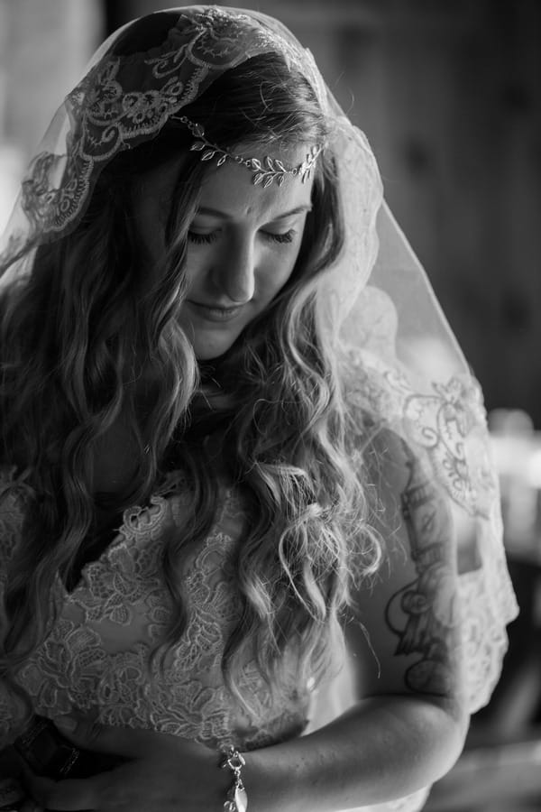 Bride with forehead chain and lace detailed wedding dress