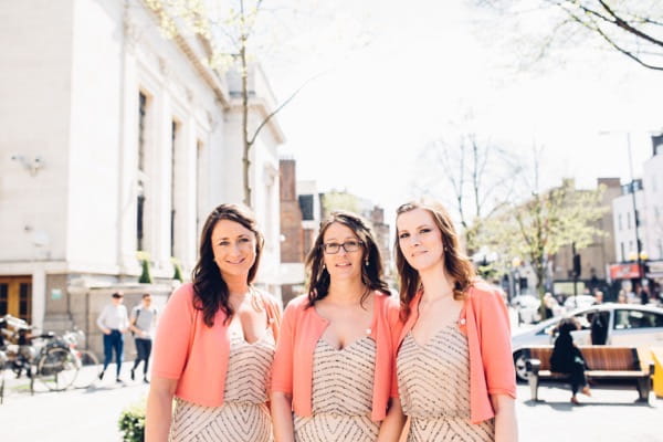 Bridesmaids wearing blush dresses and cardiagns