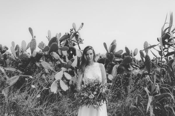 Bride holding rustic bouquet