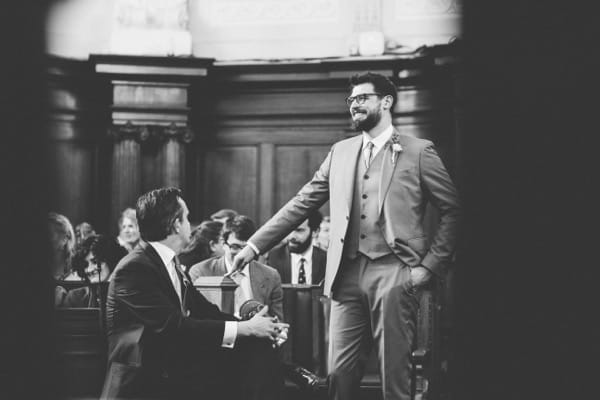 Groom waiting in Islington Town Hall for bride
