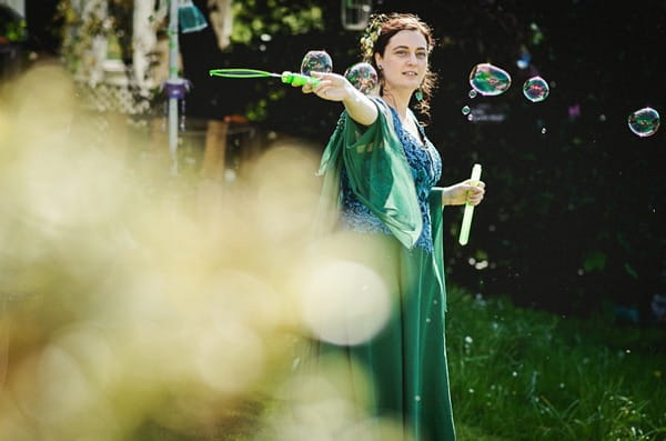 Bride using bubble wand