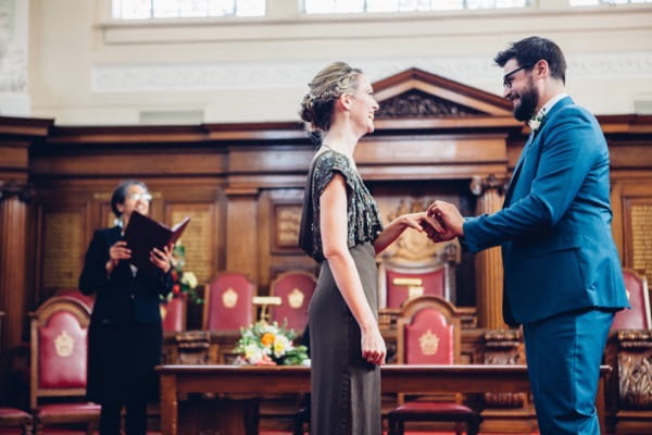 Bride and groom saying wedding vows in Islington Town Hall