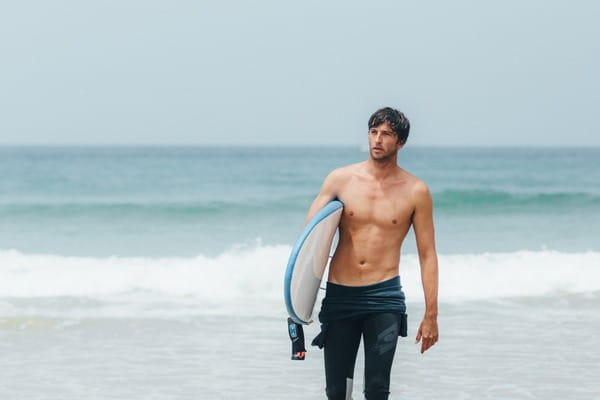 Man carrying surf board