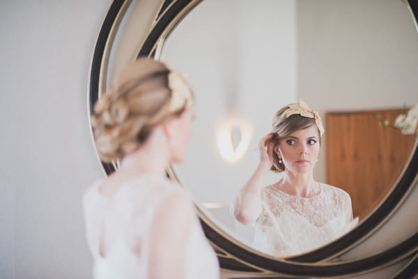 Bride looking in mirror