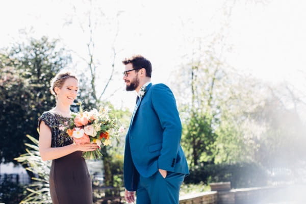 Bride with groom in blue suit