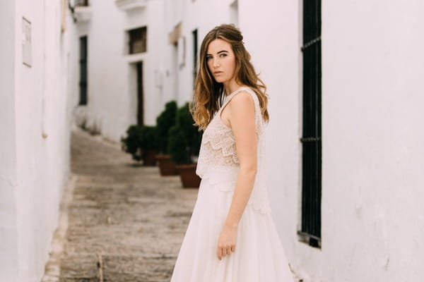 Bride standing in street in Spain