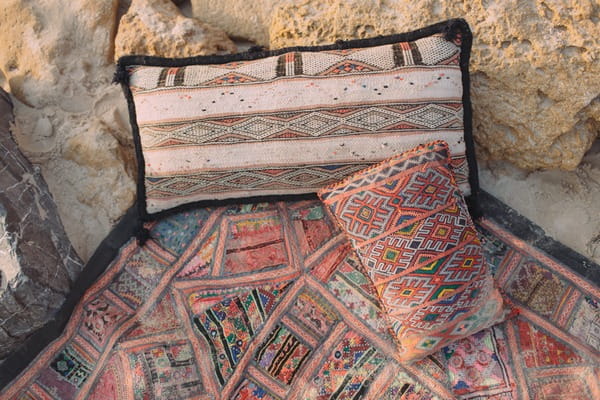 Cushions and blankets on beach in Spain