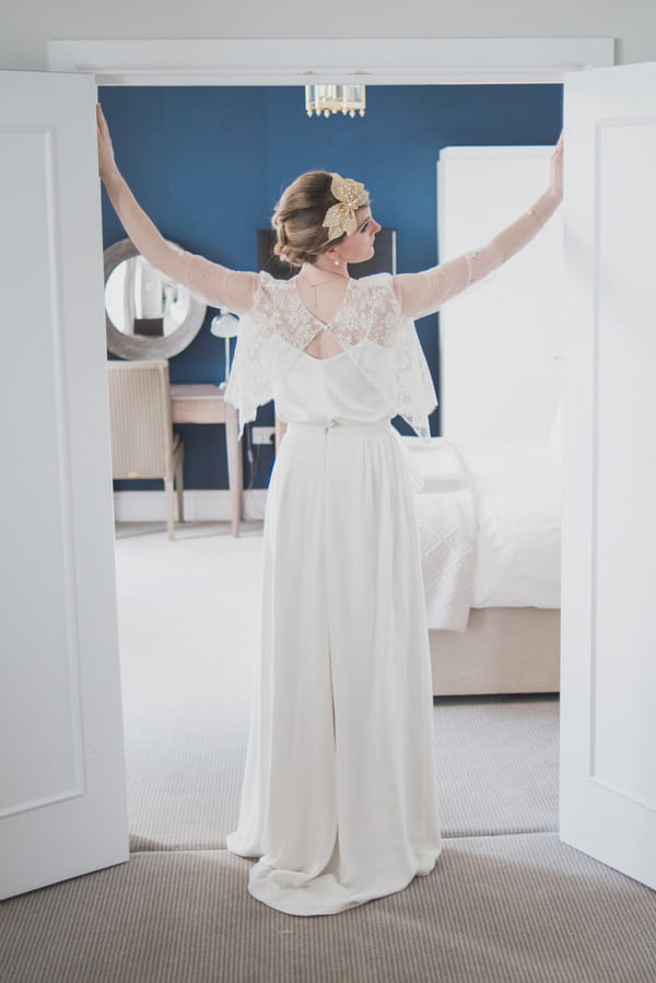 Bride standing with arms out