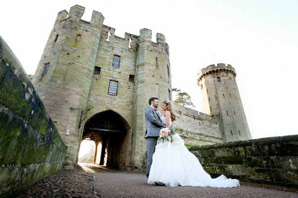 Briude and groom at entrance to Warwick Castle