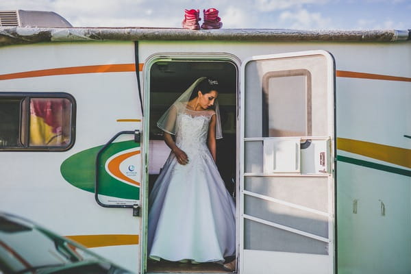 Bride leaving caravan for wedding