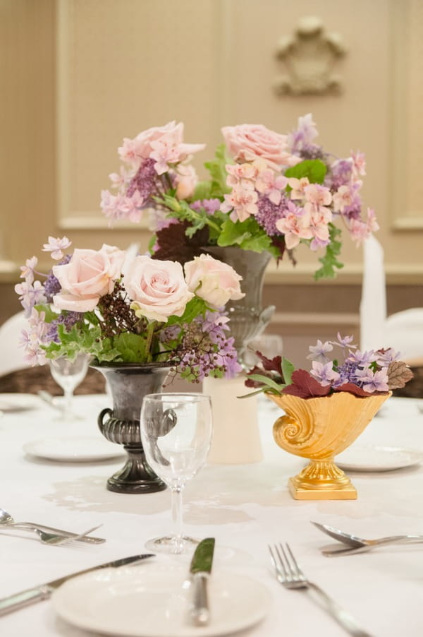 Vases of flowers on wedding table