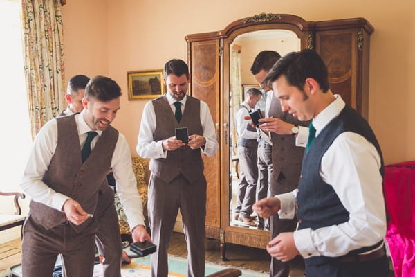 Groomsmen opening gifts