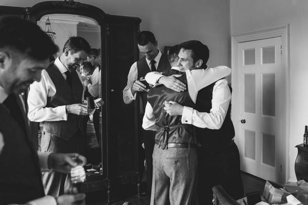 Groomsmen hugging