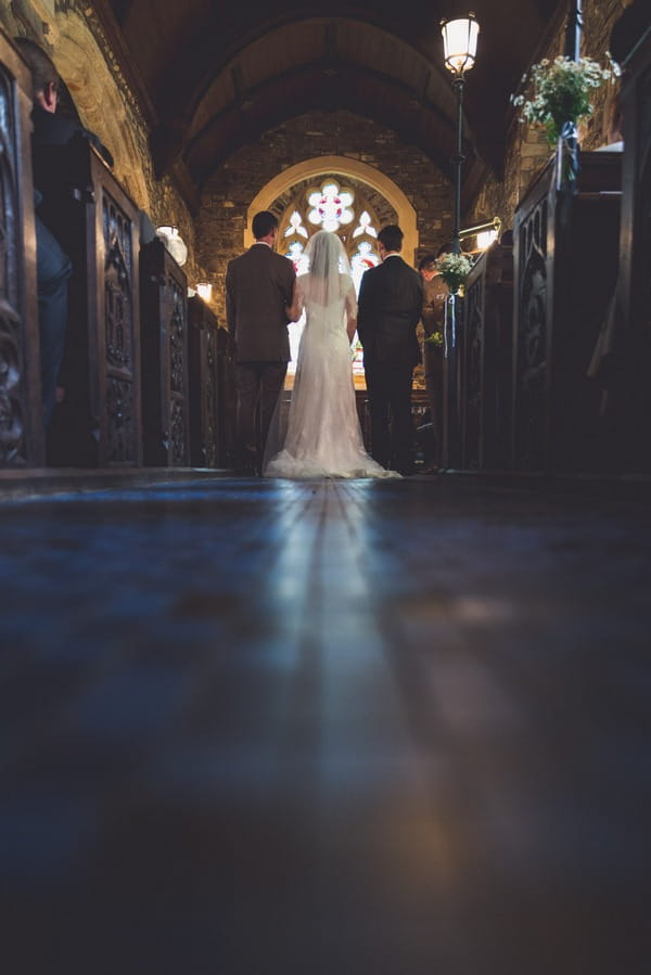 Bride and groom standing at altar