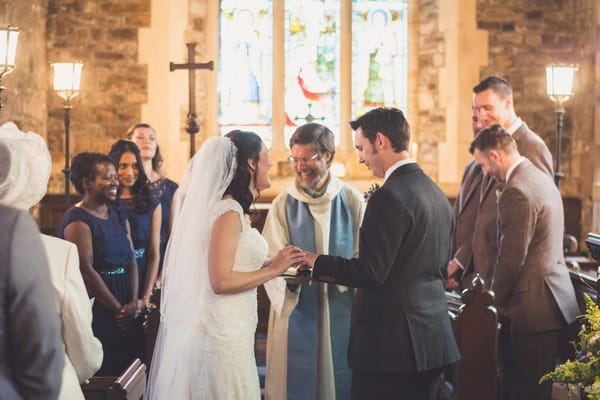 Bride laughing with vicar