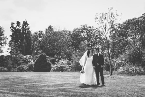 Bride and groom in grounds of Buckland House