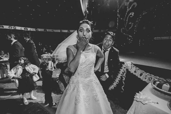 Bride with hand over mouth